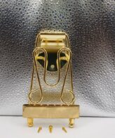 Tailpiece Trapeze W Gold | Compatible with archtop/semi‑hollow guitars — ideal for jazz or vintage‑style instruments. Enhances sustain and resonance — helps improve tone quality.