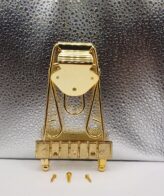 Tailpiece Trapeze W Gold | Compatible with archtop/semi‑hollow guitars — ideal for jazz or vintage‑style instruments. Enhances sustain and resonance — helps improve tone quality.
